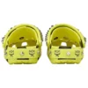 Crocs x MCM Clogs met camouflageprint “Neon Yellow”